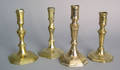 Three Queen Anne brass candlesticks mid 18th c