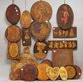 Twentyfive Pyrographicdecorated Wood Plaques Depicting Young Women Children and Dutch Children