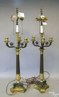 Pair of ebonized and gilt metal table lamps