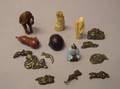 Six Assorted Japanese Netsuke and a Small Group of Japanese Metal Sword Parts