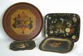 Four tole decorated trays late 19thearly 20th c