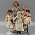 One Small China and Four Bisque Head Dolls