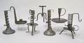 Four wrought iron table top candlesticks late 18thearly 19th c