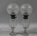 Pair of Colorless Cut Glass Kerosene Table Lamps with Etched Glass Globes