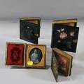 Four Daguerreotype Portraits in Abaloneinlaid Lacquer and Albumtype Cases