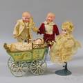 Four Small Bisque Dolls and a Pressed and Painted Tin Carriage