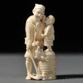 Ivory Okimono of a Man Holding a Hoe