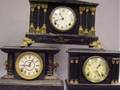 Three Neoclassical Black Painted Mantel Clocks