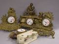 Four Gilt Cast Metal Figural and Alabaster Mantel Clocks