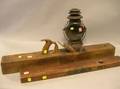 Large Cherry Hand Plane a Stanley Rule and Level Co Brass Mounted Cherry Level No 2 and a Dietz Black Painted Tin Driving Lamp
