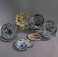 Twelve Assorted Mostly Polychrome Tinglazed Ceramic Plates