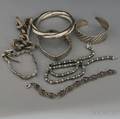 Six Mostly Silver Bracelets and a Necklace