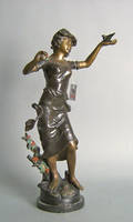 Bronze figure of a woman clutching a bird in one hand