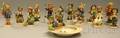 Thirteen HummelGoebel Ceramic Figures and Figural Groups and an Ashtray