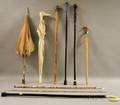 Eight Umbrellas Canes and Walking Sticks