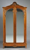 French Provincialstyle Carved Walnut and Mirrored Armoire