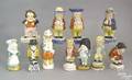 Eleven Staffordshire shakers and figures 19th c