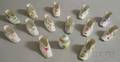 Thirteen Herend Handpainted Porcelain Baby Shoes and a Small Covered Eggshaped Jar