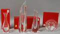 Three Baccarat Colorless Crystal Vases and a Trivet