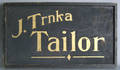 J Trinka Tailor trade sign