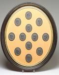 Framed Group of Twelve Wedgwood Black Basalt Portrait Medallions
