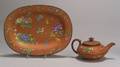 Two Wedgwood Enamel Decorated Rosso Antico Items