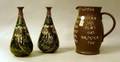 Pair of Royal Doulton Glazed Stoneware Vases and a Leatherware Motto Pitcher