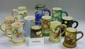 Eleven Assorted Decorated Porcelain Steins