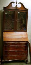 Chippendalestyle Mahogany and Mahogany Veneer Slantlid Serpentine Desk Bookcase