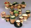 Fourteen Small and a MidSize Doulton Character Jugs and Smoking Articles