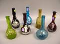 Seven Victorian Enamel Decorated Colored Glass Bottle Vases