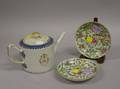 Chinese Export Porcelain Armorial Teapot and a Pair of Export Saucers