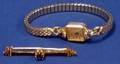 Gold and Sapphire Bar Pin and a Womans Omega Wristwatch