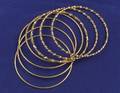 Seven 18kt Gold Bangles
