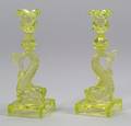 Pair of Pressed Glass Vaseline Dolphin Candlesticks