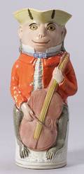 Staffordshire Pottery Toby Jug with Monkey Figure