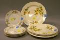Set of Five Floral Decorated Ceramic Dinner Plates and a Set of Four Limoges Floral Decorated Porcelain Bread and Butter Plates