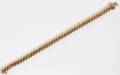 14KT YELLOW GOLD AND DIAMOND TENNIS BRACELET