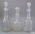 Three AngloIrish clear glass decanters 19th c