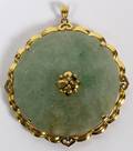 CHINESE ROUND JADE AND 14KT GOLD PENDANT