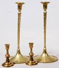 BRASS CANDLESTICKS FOUR PIECES