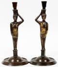 PATINATED METAL FIGURAL CANDLESTICKS PAIR