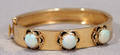 020121 14KT YELLOW GOLD AND OPAL HINGED BANGLE BRACELE