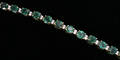 120102 DIAMOND AND EMERALD 14 KT GOLD BRACELET
