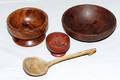 1192 CARVED WOOD BOWLS AND A SPOON FOUR PIECES DIA 2