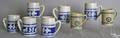 Eight Williamsburg stoneware mugs