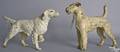 Two cast iron dog doorstops