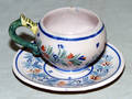 1335 QUIMPER FRENCH POTTERY CUP AND SAUCER HENRIOT