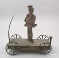 Folky painted tin hangman platform toy late 19th c