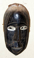 113287 OVAL CARVED WOOD AFRICAN MASK 10 X 5